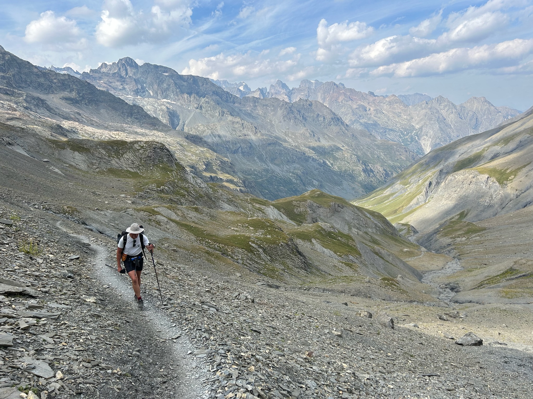Hiker on a high mountain trail in the Écrins, GR54